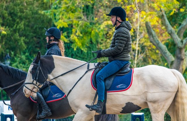 horse riders on a green lane