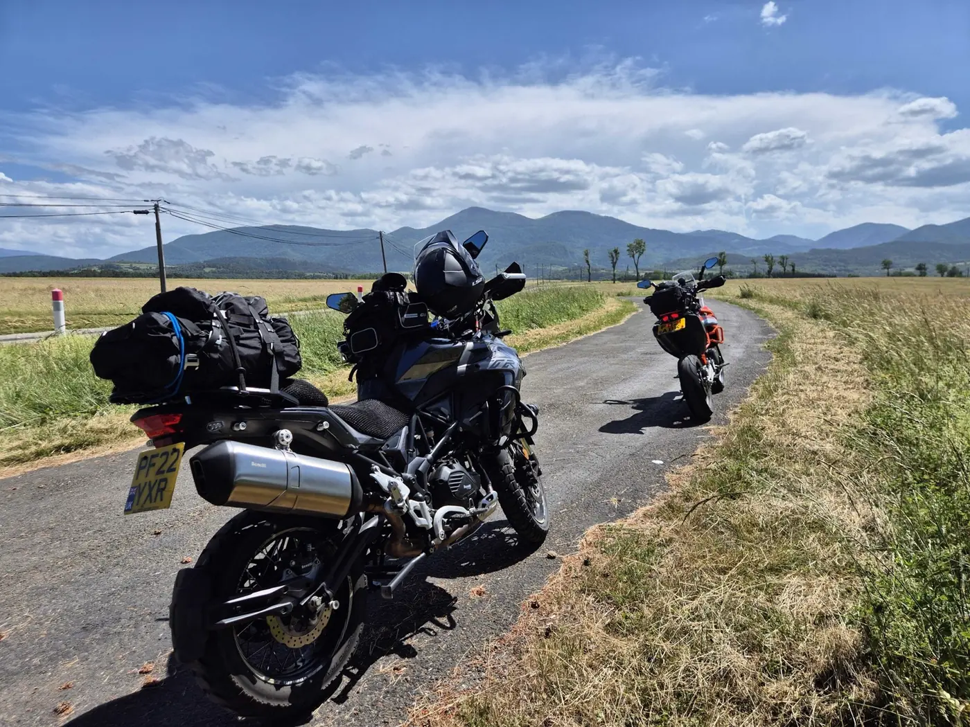 Our Benelli TRK 502X loaded with touring luggage on a road in the French Pyrenees