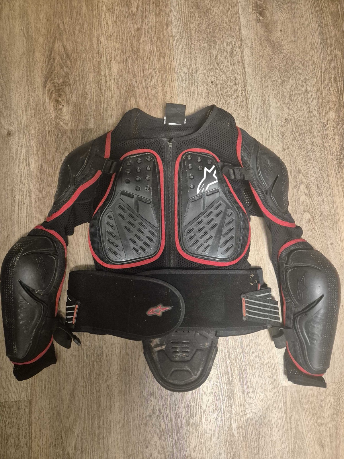 An Alpinestars Bionic adventure jacket laid out flat, the kind of CE Level 2 protection built for both road and trail