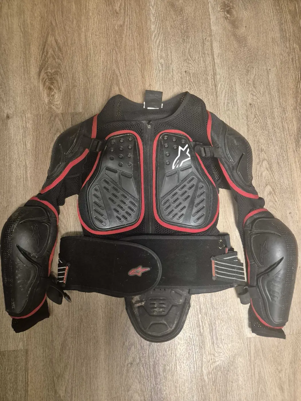 An Alpinestars Bionic adventure jacket laid out flat, the kind of CE Level 2 protection built for both road and trail