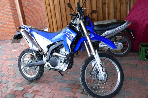 older used trail bike on a green lane