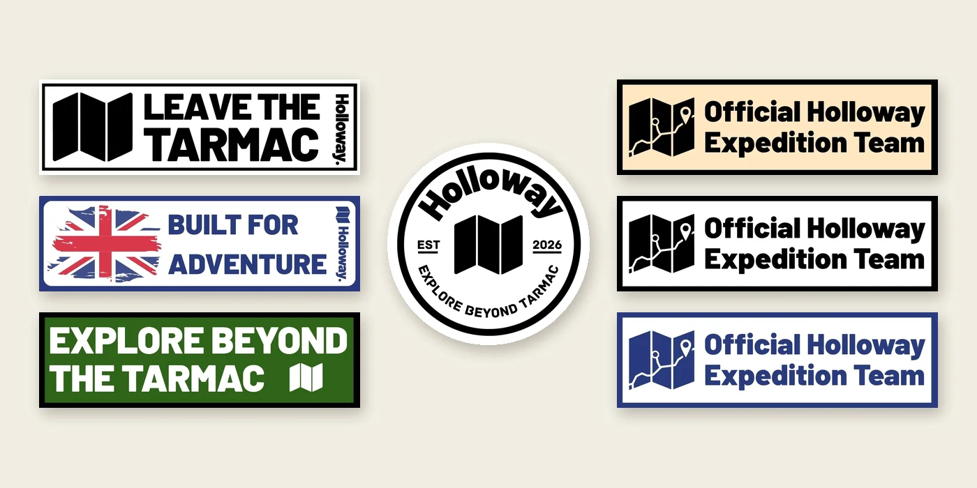 All seven Holloway motorcycle stickers laid out together: the round badge and six rectangular stickers
